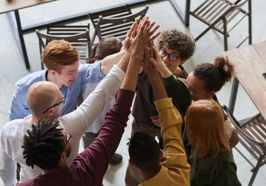 Photo Of People Holding Each Other's Hands